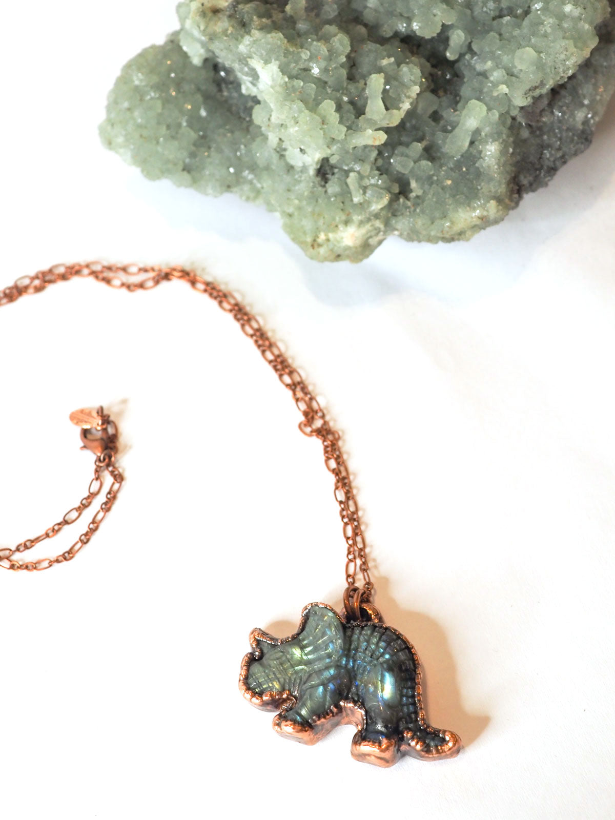 Carved labradorite triceratops eletroformed copper pendant on a copper chain
