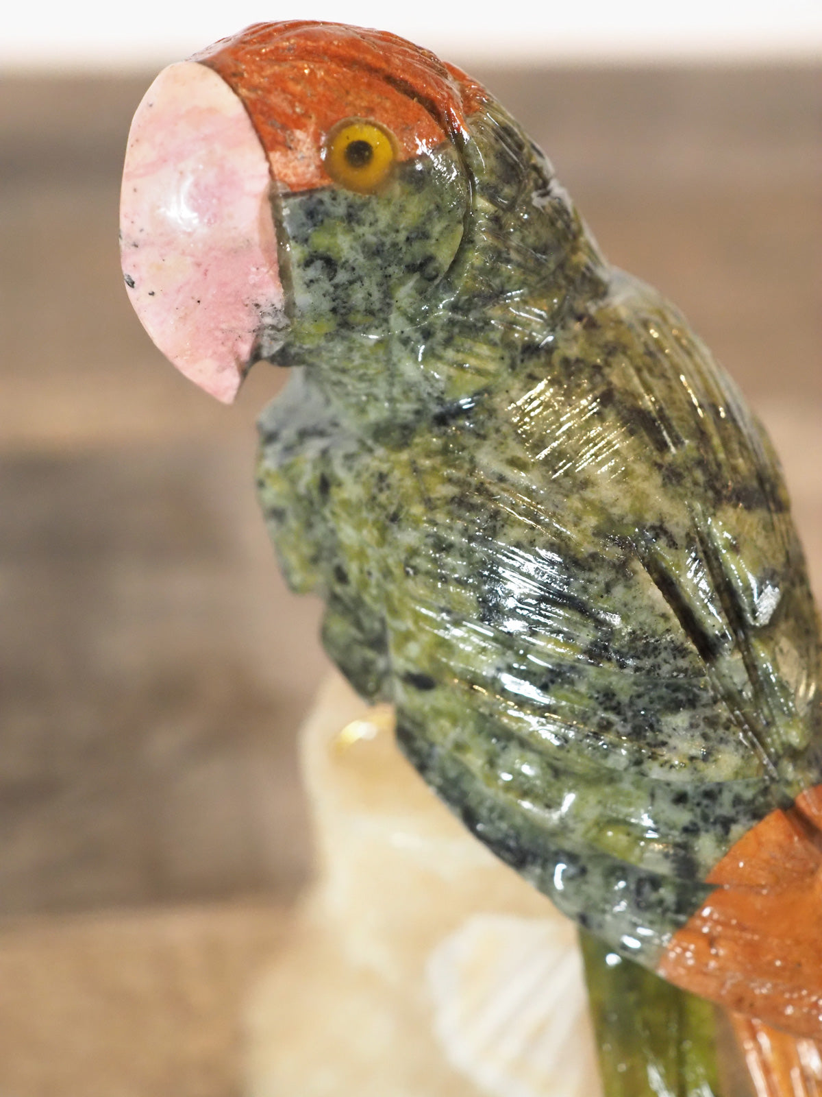 hand-carved parrot with hand-painted accents