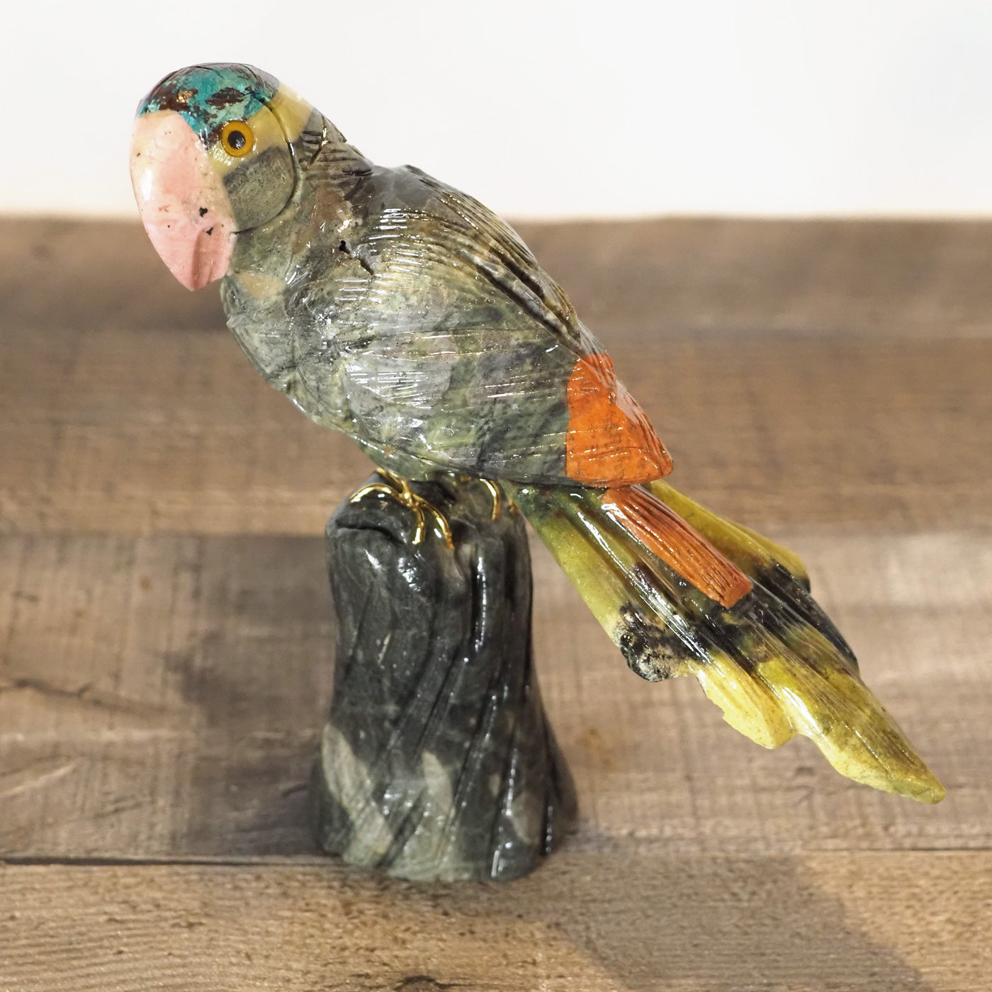 hand-carved parrot with hand-painted accents