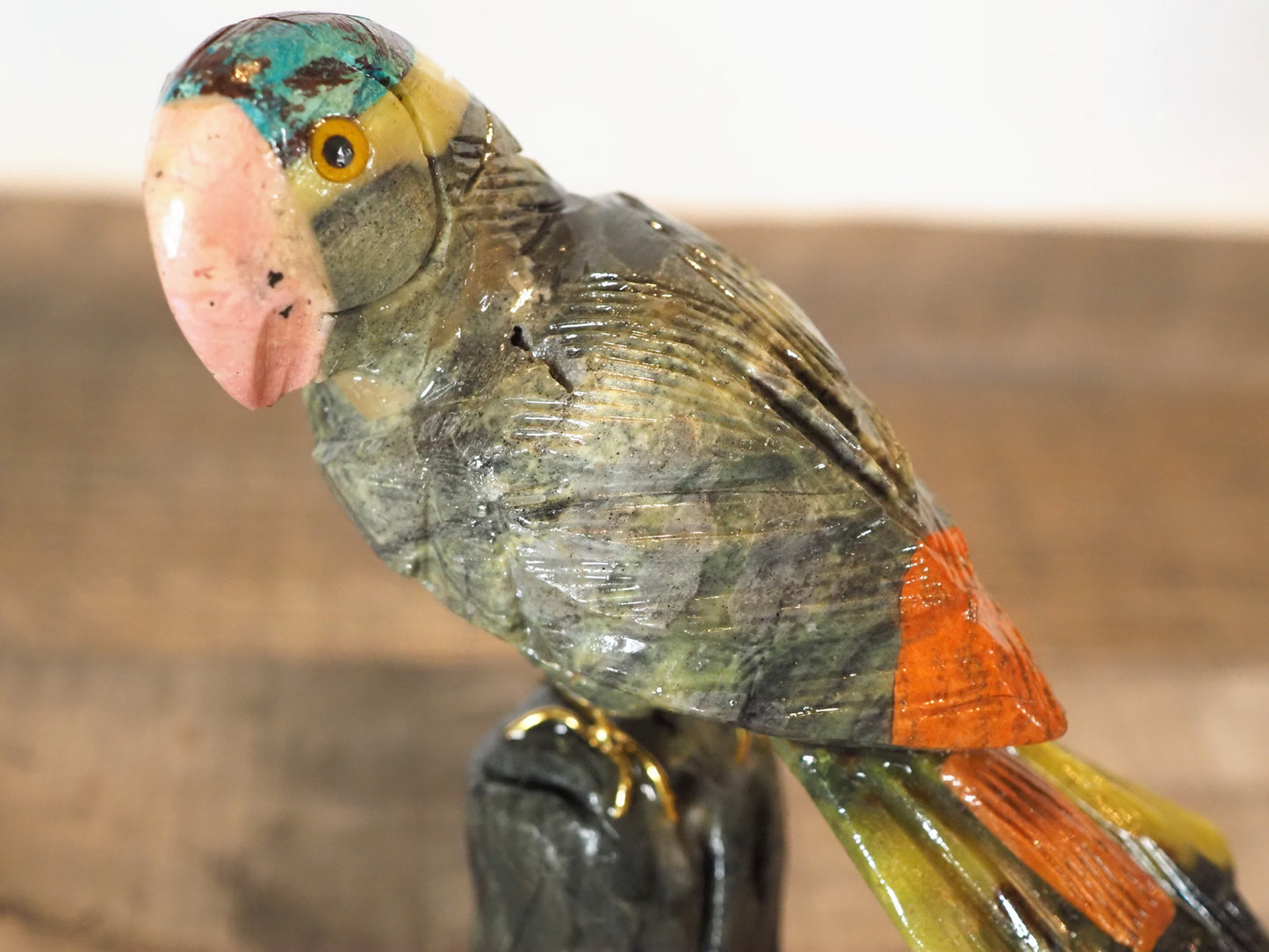 hand-carved parrot with hand-painted accents