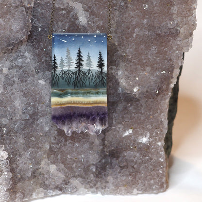 Hand-painted resin and amethyst slice rectangular necklace featuring a scene of a forest with its roots going into the ground, under a night sky with shooting stars