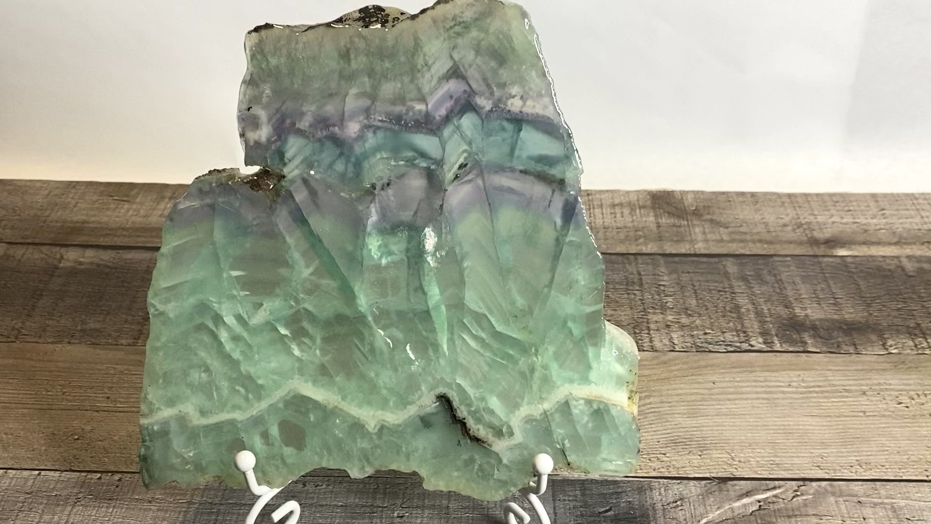7" x 7" pastel Rainbow Fluorite slab sitting on included white metal stand - Video