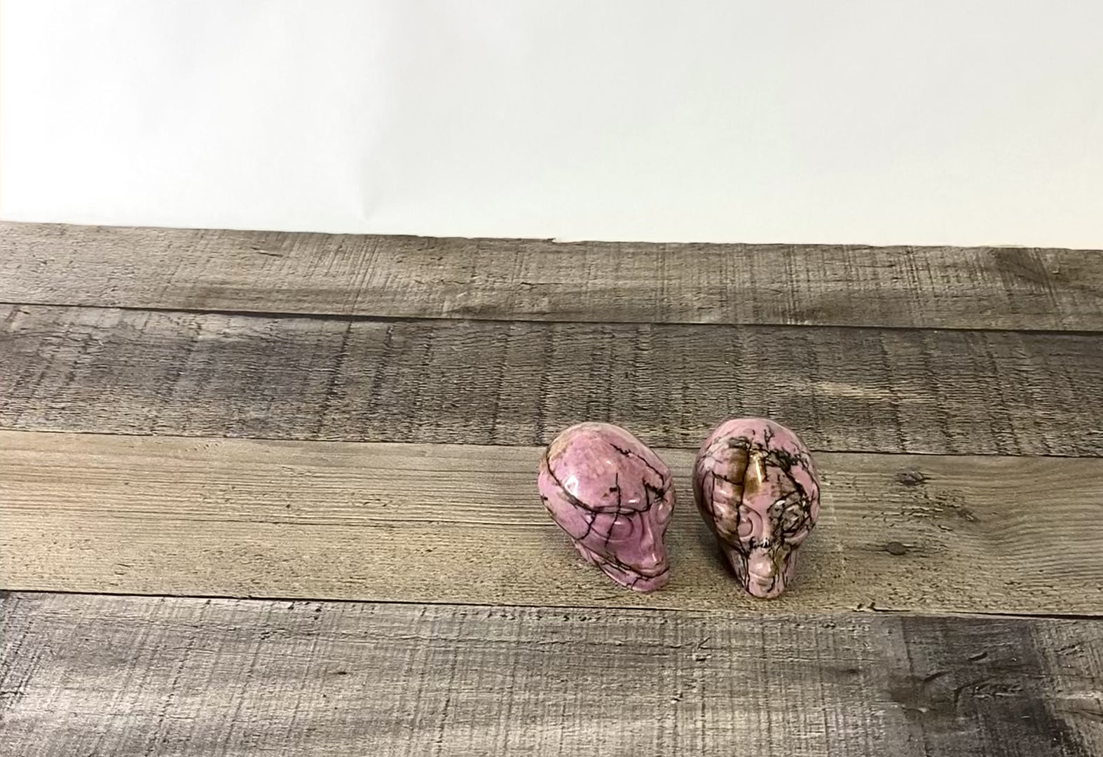 2 Hand-carved Rhodonite Alien Heads measuring about 2.25" - Video