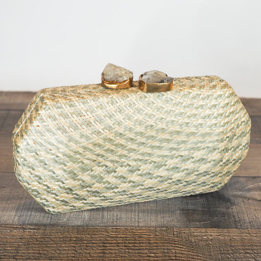 Handloomed clutch made from natural plant fibers carefully extracted from the stalks of the tropical buri palm in the Philippines and finished with a beautiful quartz stone closure.