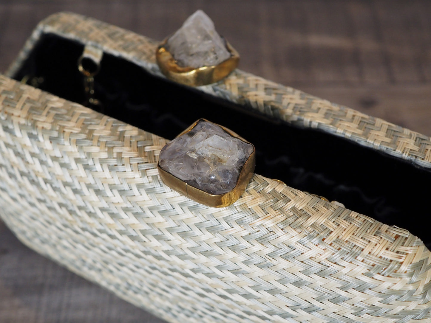 Handloomed clutch made from natural plant fibers carefully extracted from the stalks of the tropical buri palm in the Philippines and finished with a beautiful quartz stone closure. -  Shown open