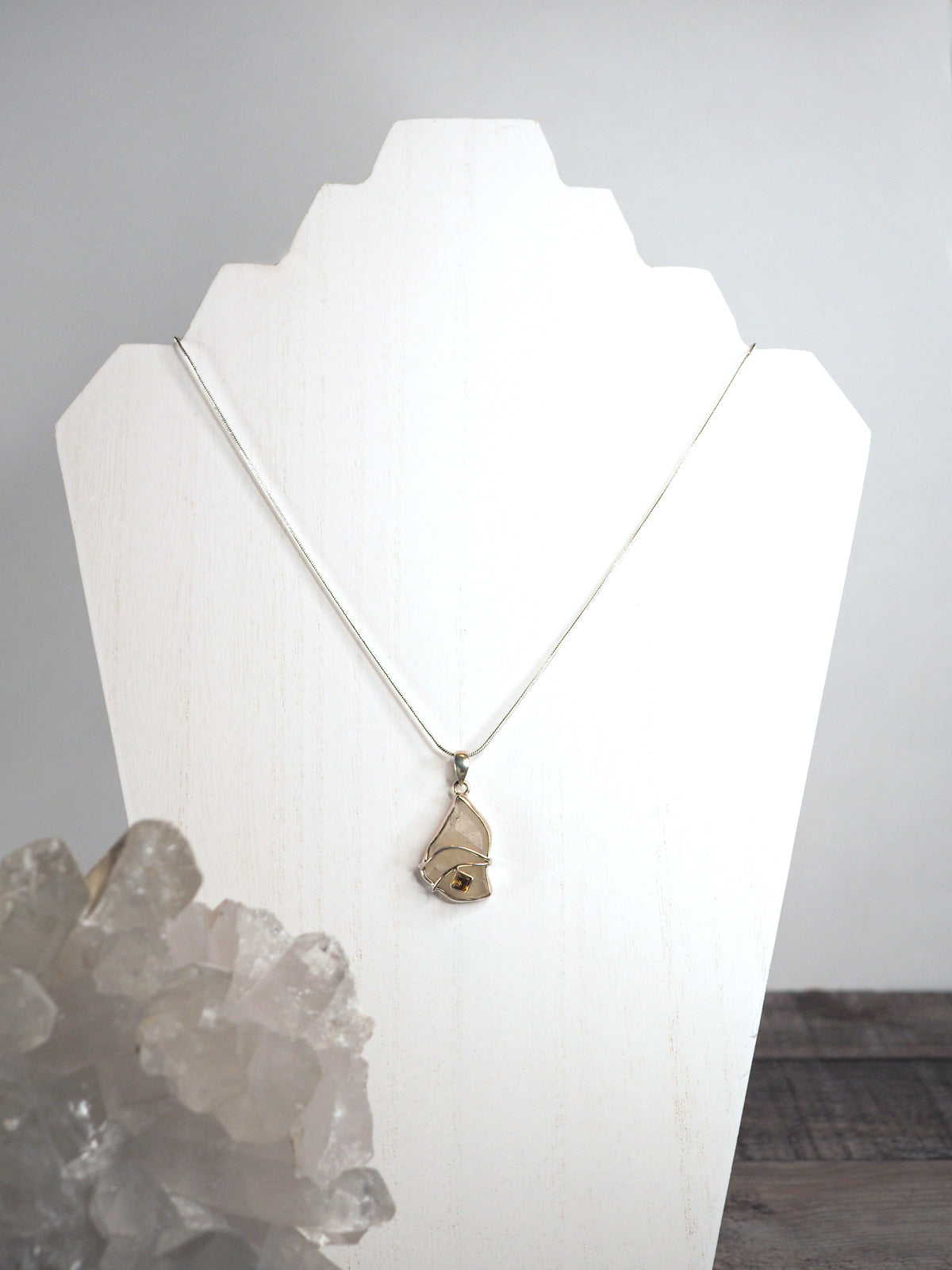 Libyan Desert Glass Pendant Necklace with Citrine in a Sterling Silver Setting Hanging on a Silver Chain