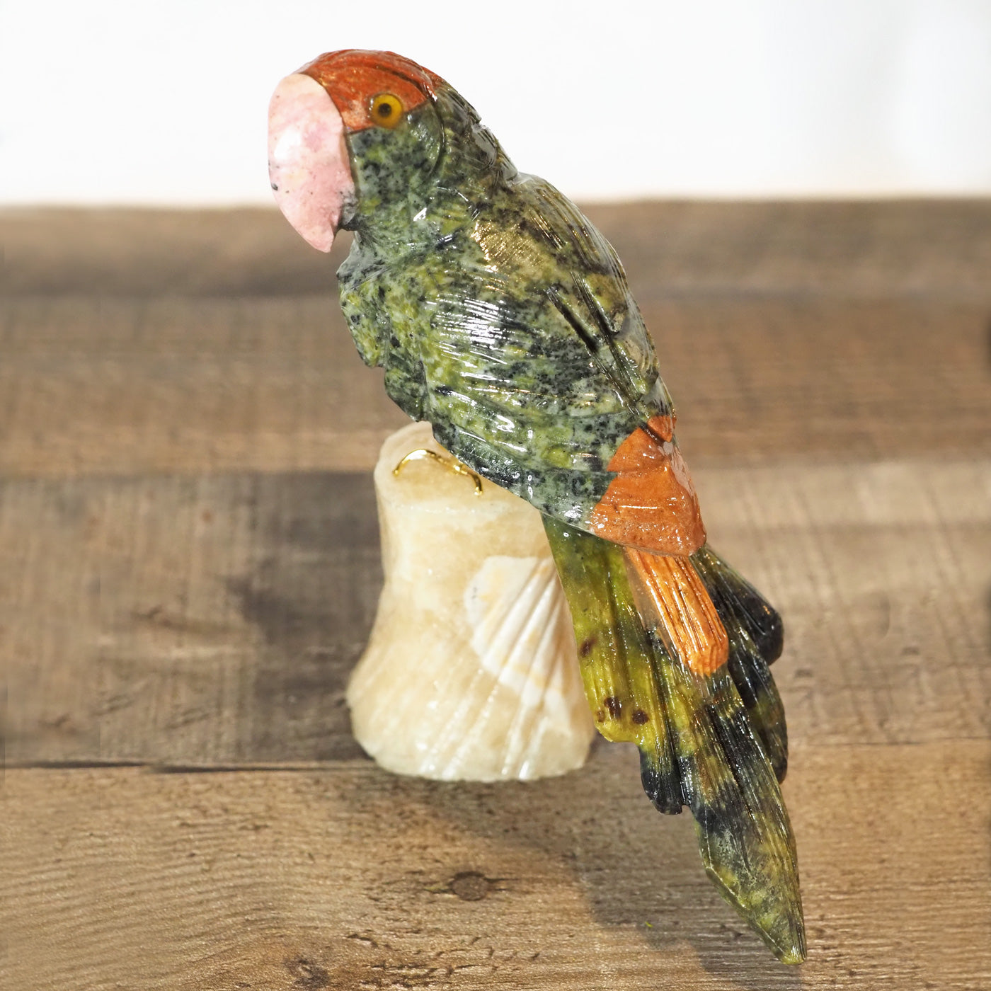 hand-carved parrot with hand-painted accents