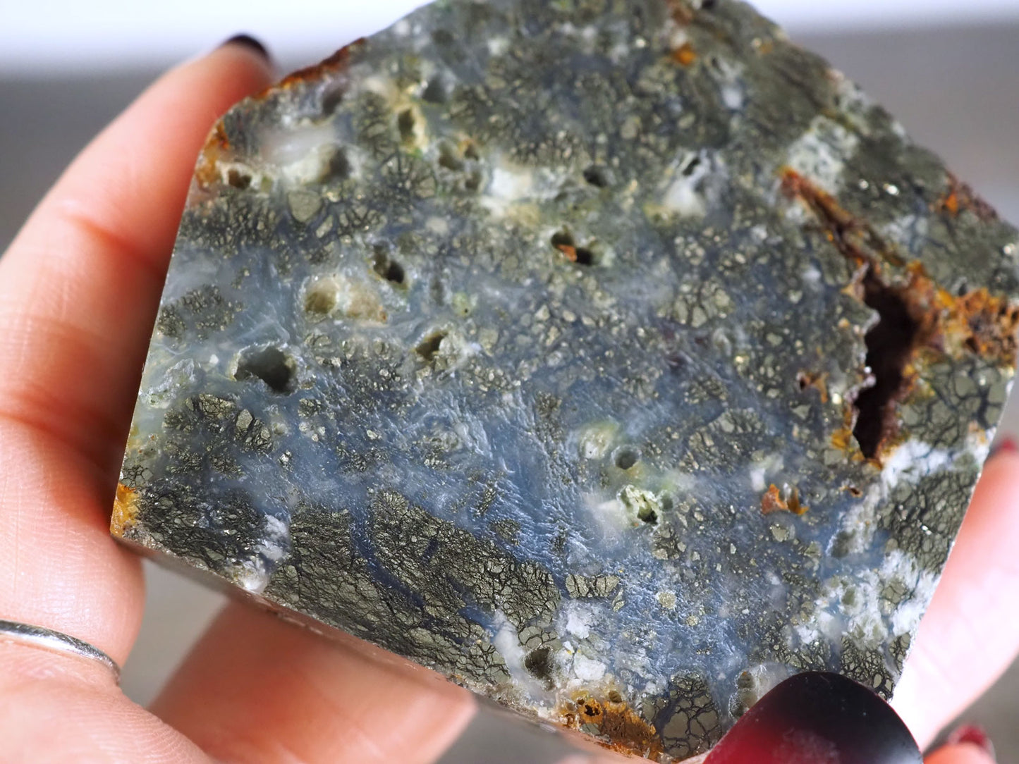 Pyrite Flower Agate Slab with Iron deposits - Closeup in hand