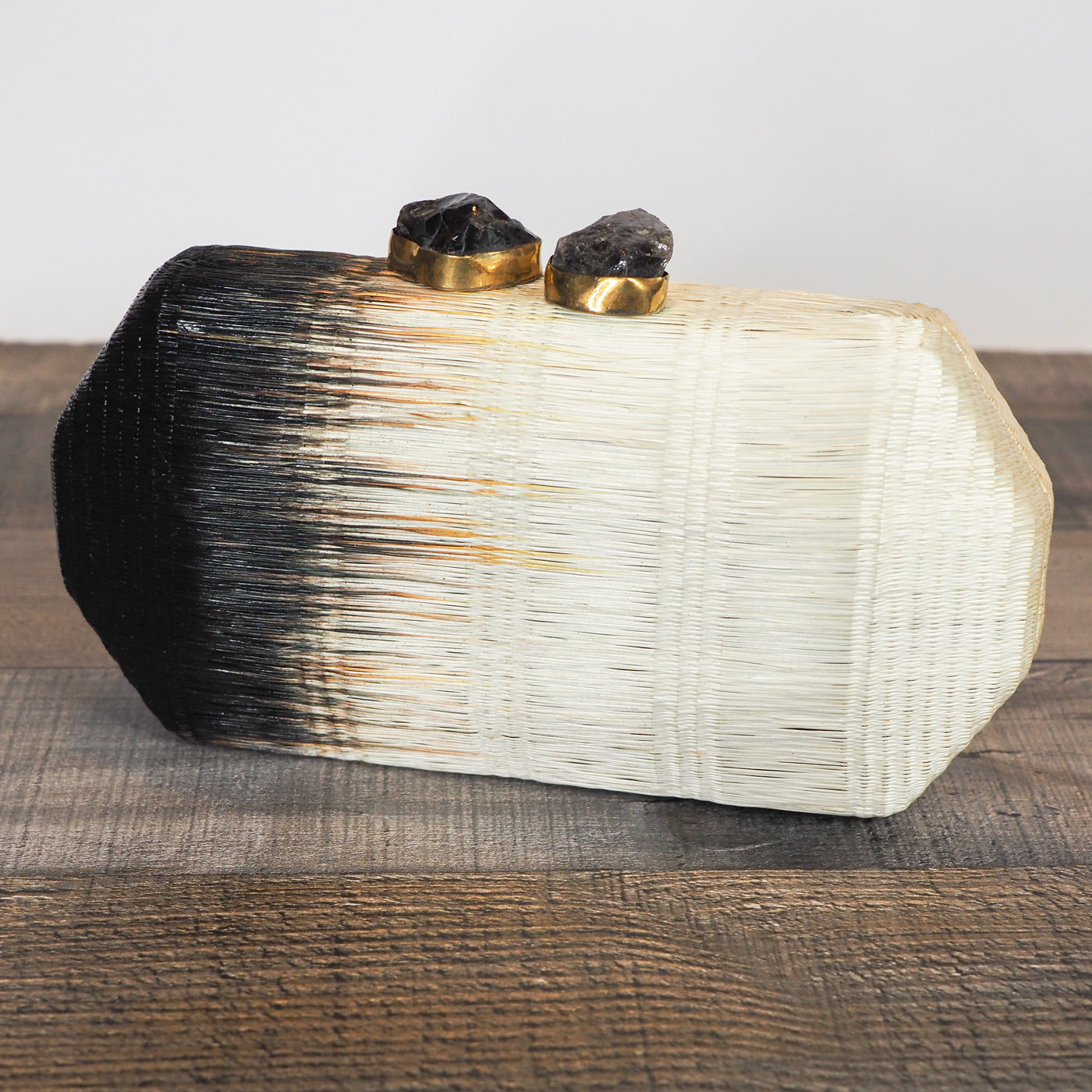 Handloomed clutch made from natural plant fibers carefully extracted from the stalks of the tropical buri palm in the Philippines and finished with a beautiful quartz stone closure. - 