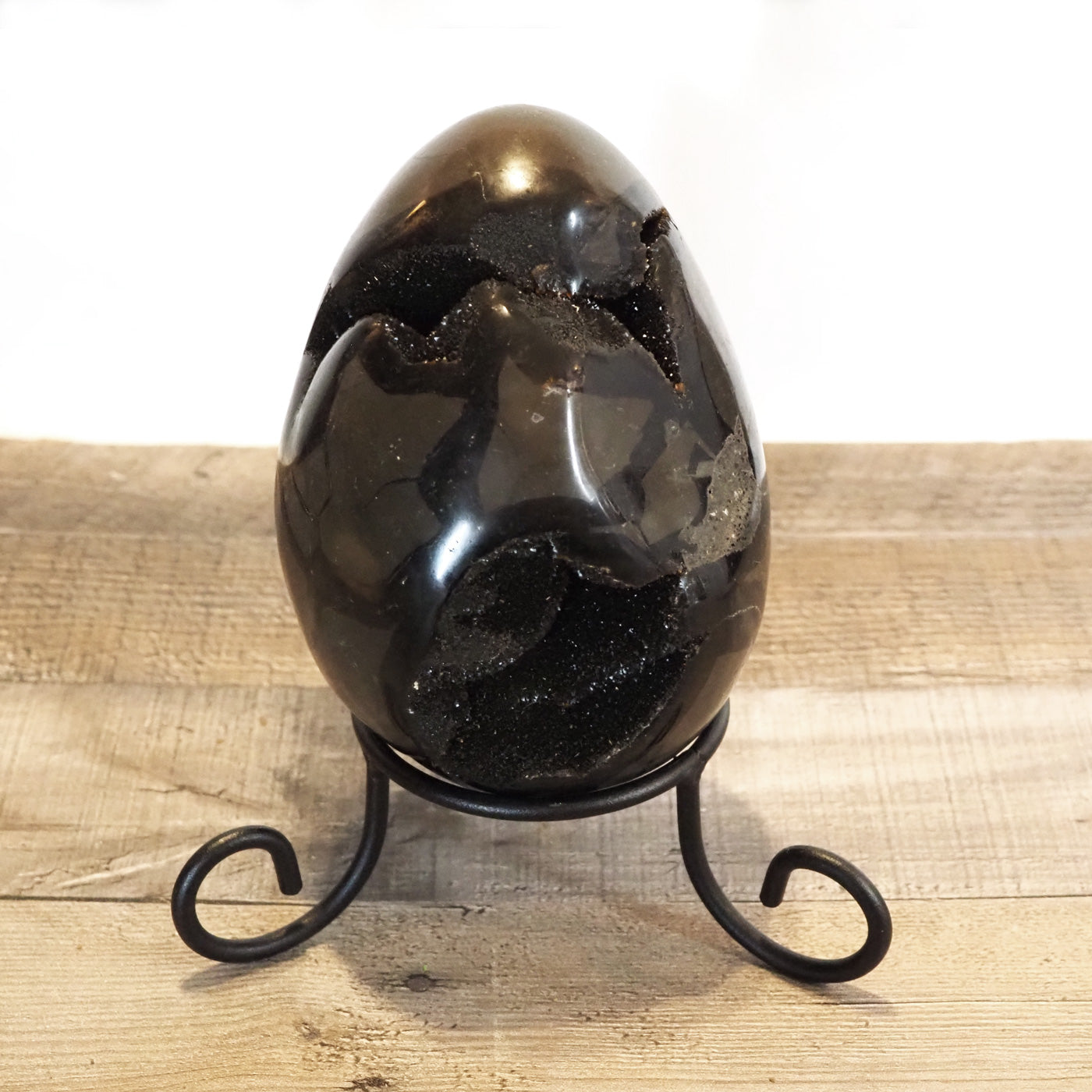 6" tall x 4.5" wide Septarian Dragon Egg sitting on included wrought iron stand