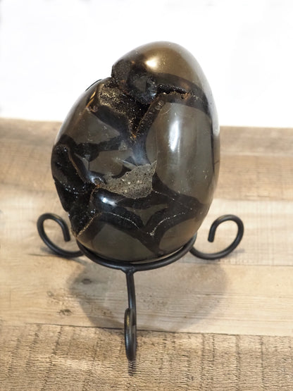 6" tall x 4.5" wide Septarian Dragon Egg sitting on included wrought iron stand