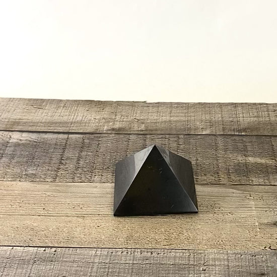 Deep black Shungite pyramid that is about 3" square at the base - Video