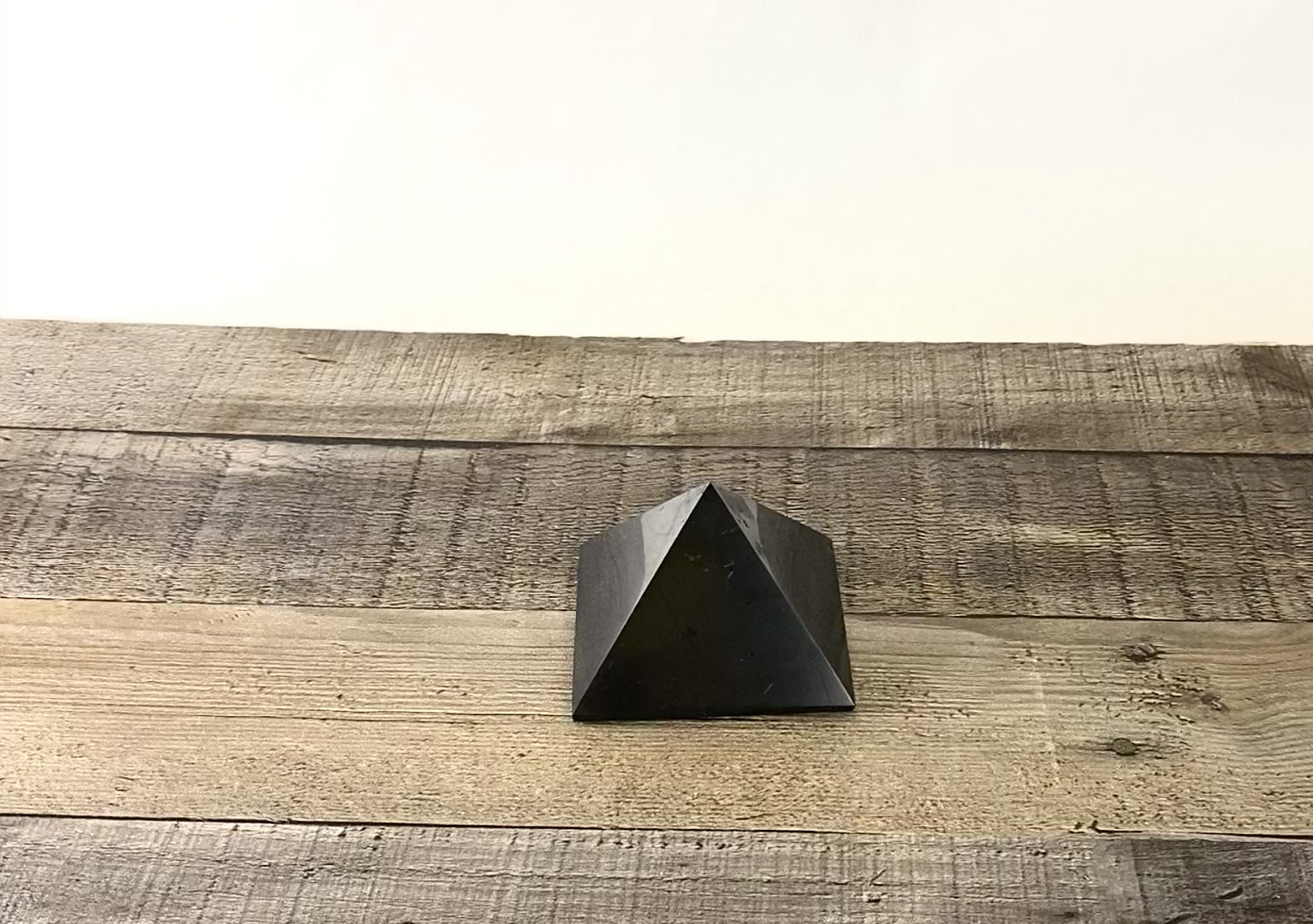 Deep black Shungite pyramid that is about 3" square at the base - Video